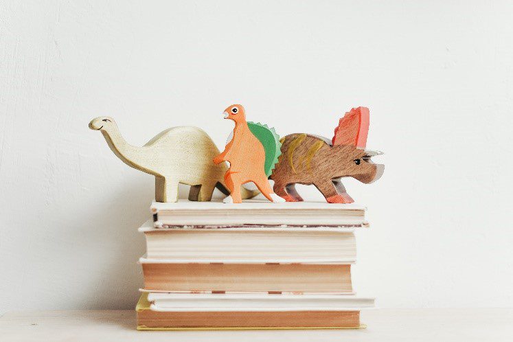 A picture of three wooden animal toys